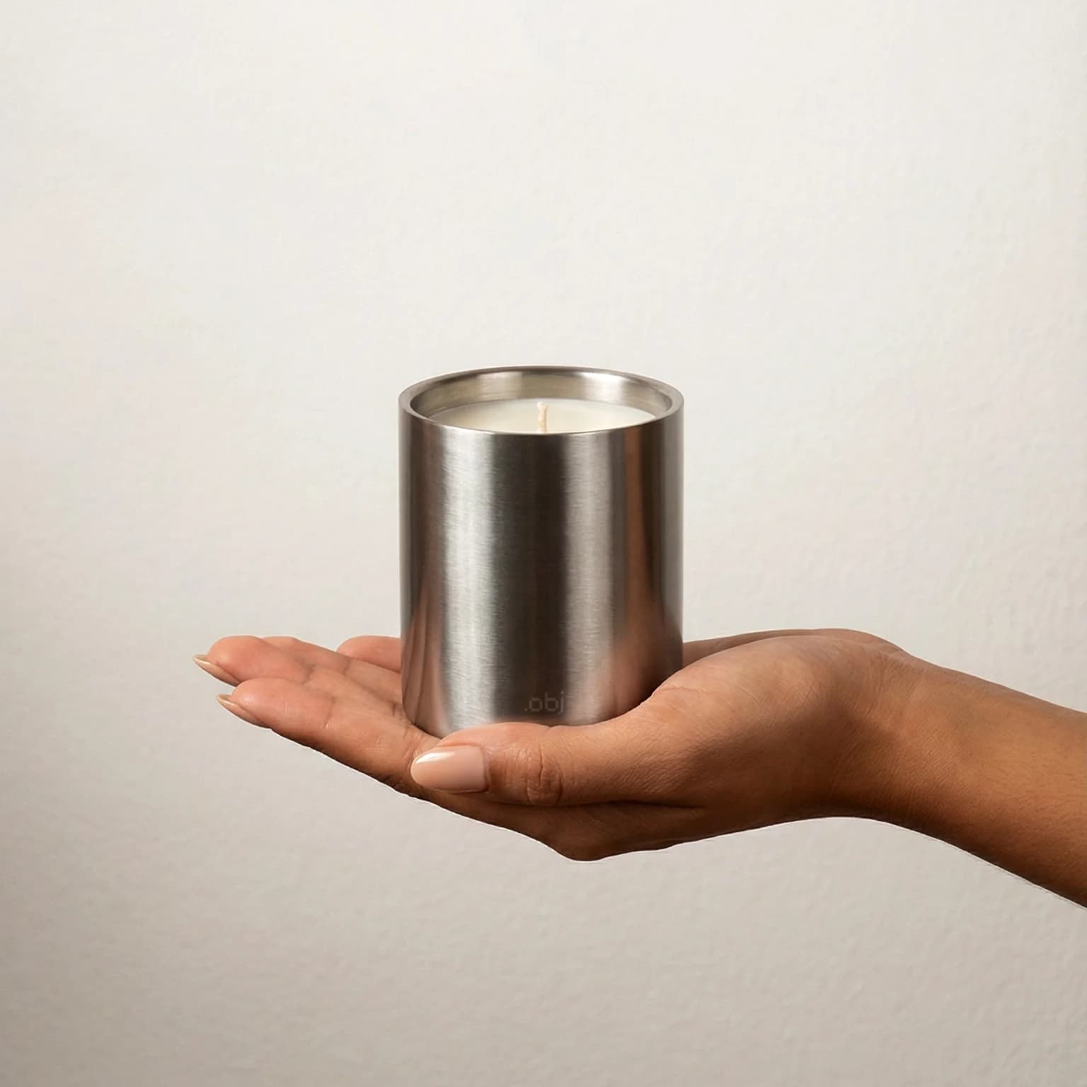 On-brand .OBJ Studio candle launch image